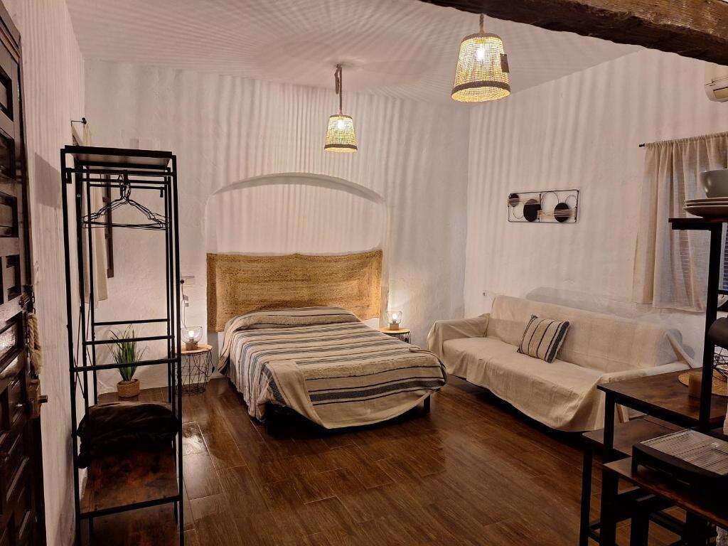 Rustic bedroom interior at Alojamiento Rural los Duendes in El Puerto de Santa María (3)